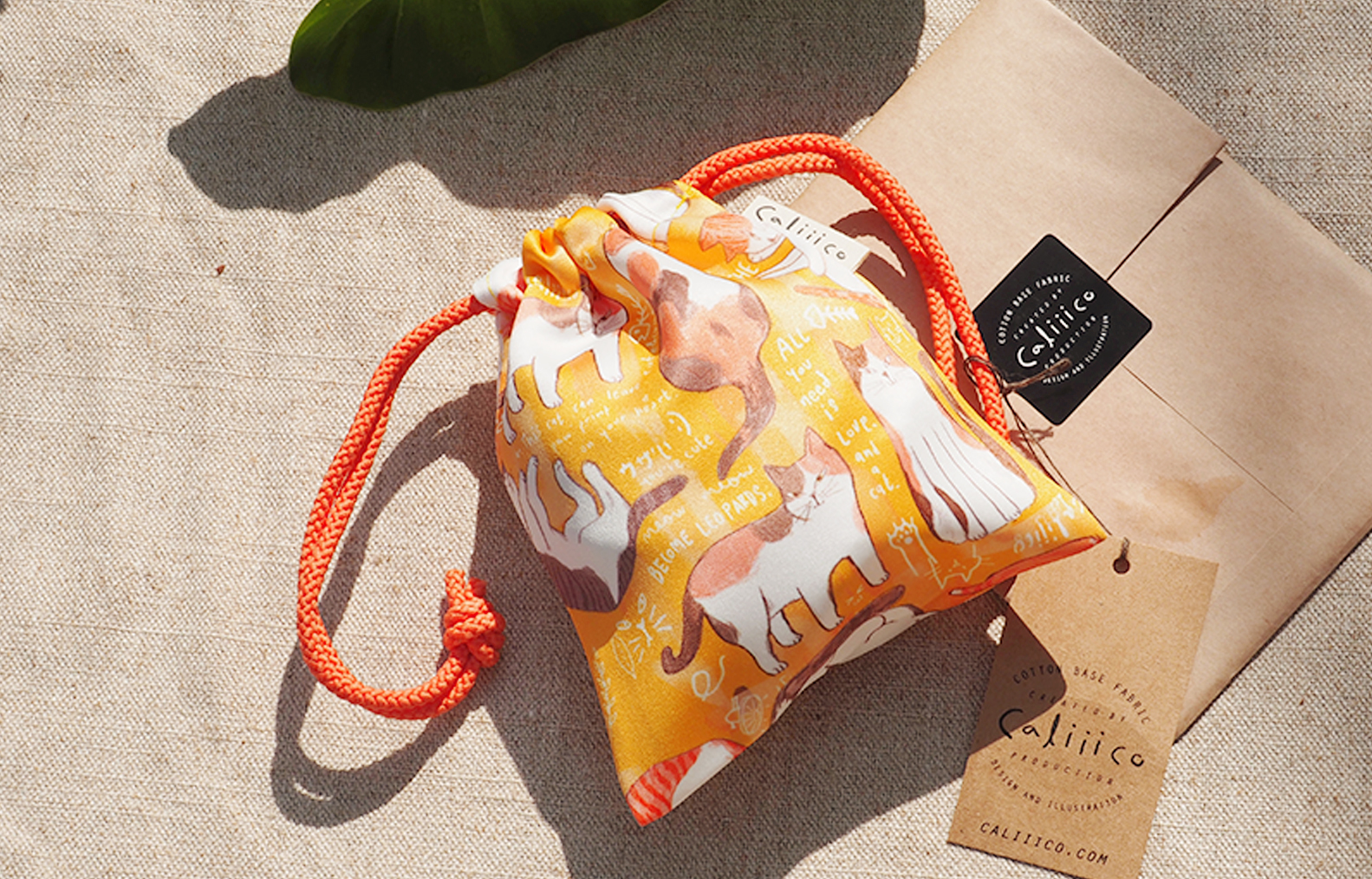 ถุงผ้าหูรูดซาติน ลายรวมแมวเหลือง Smallbag Satin print