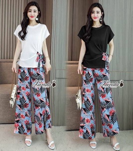 เสื้อทรงปล่อยสีพื้นเก๋ที่มีผ้าลายเดียวกับกางเกง