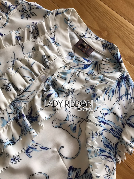 เซ็ตแขนกุดตกแต่งระบายและกางเกงขาสั้นสีขาว