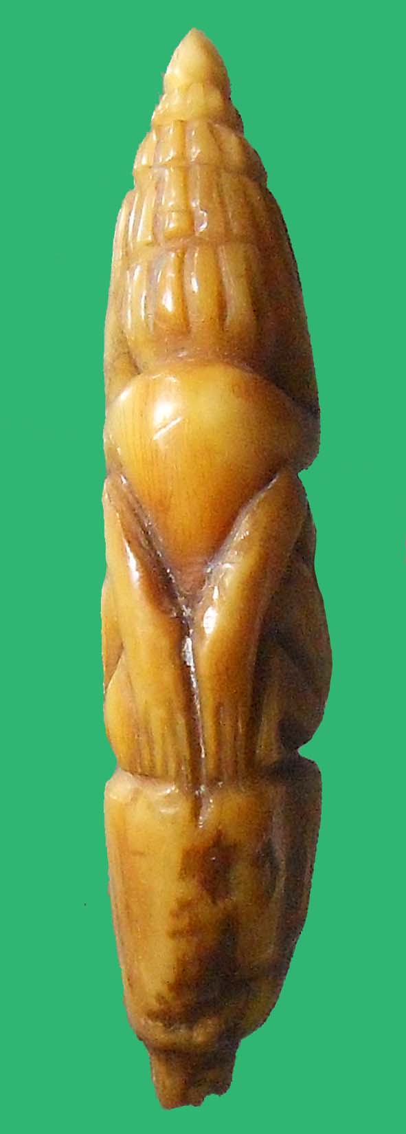 พระปิดตาเขี้ยวเสือแกะเก่า (ขนาด 1 x 5 ซ.ม. หนัก 4.48 กรัม)